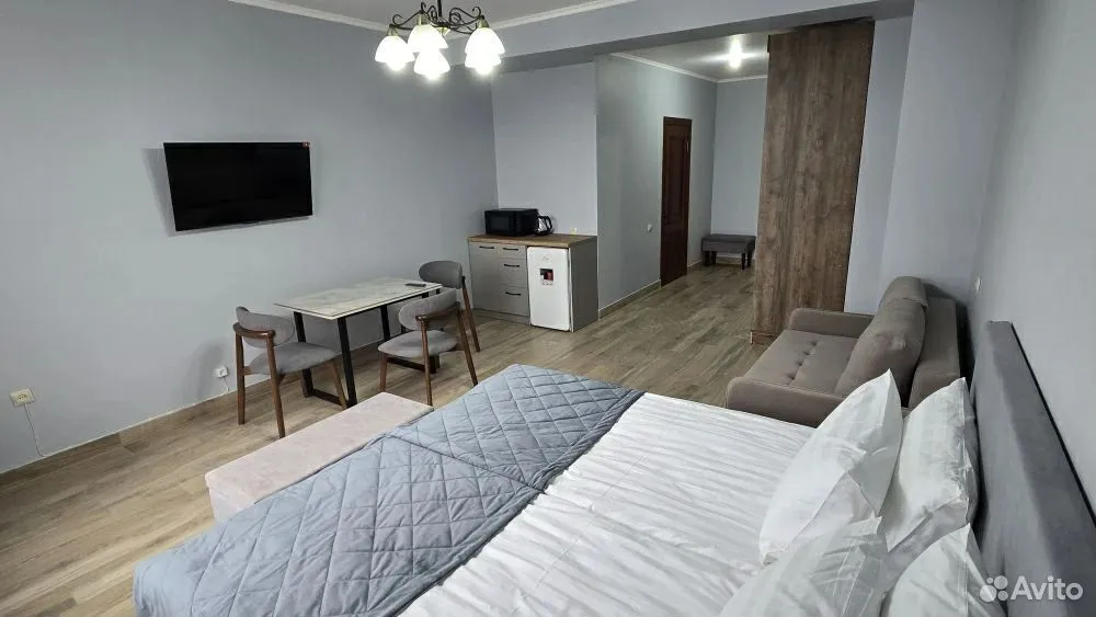Номер 25 м² — спальная зона с кроватями